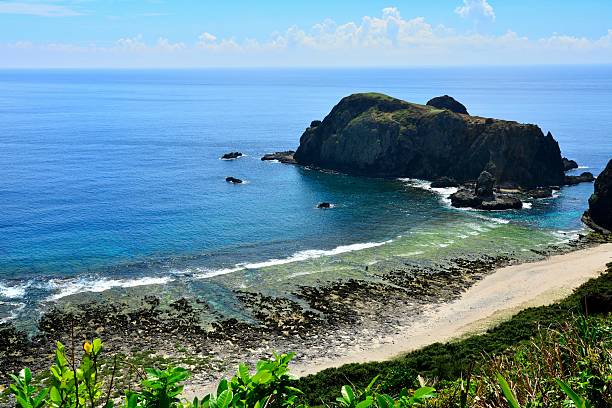 istock Jagged rocks with blue and zigzag coastline 487938174