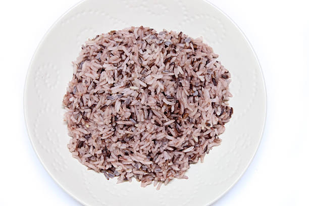 istock Rice mix purple rice berry rice in white plate 487939128