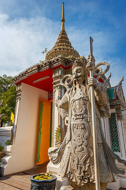 istock Guardian Statues at Wat Pho (Pho Temple) in Bangkok, Thailand 487941036