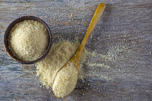 istock brown sugar heap and wooden spoon 487941214