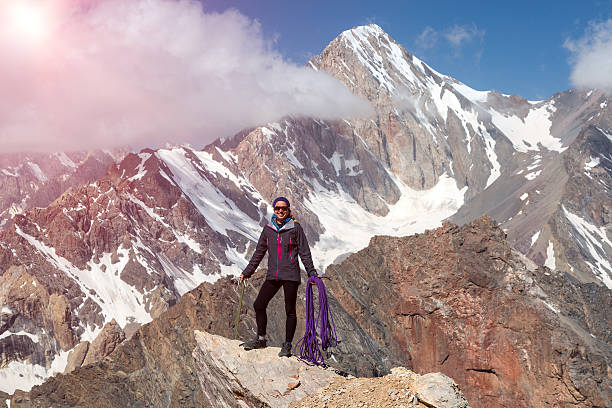 istock Female Climber Holding Ice Axe and Alpine Rope 487941412