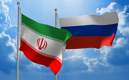 Flags from Iran and Russia flying side by side for important talks.