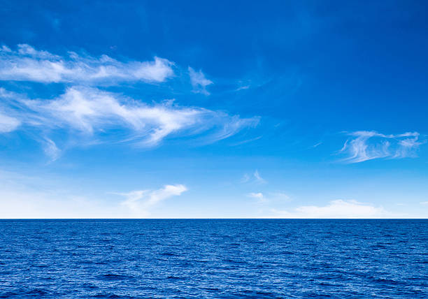 istock white fluffy clouds with rainbow in the blue sky 487945946
