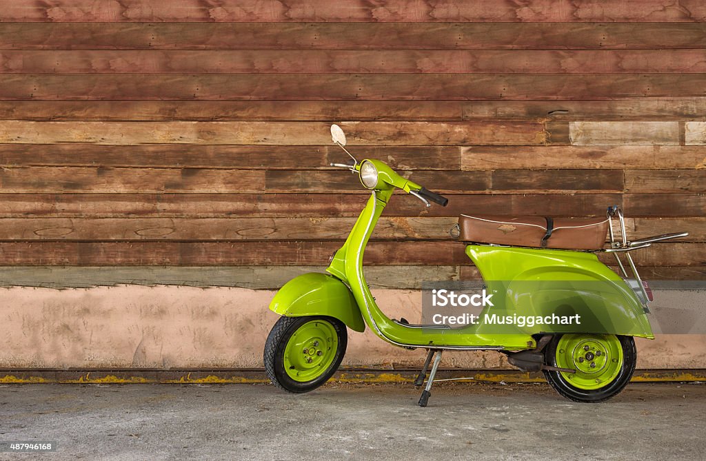 Modern classic scooter Modern classic scooter on a wood background 2015 Stock Photo