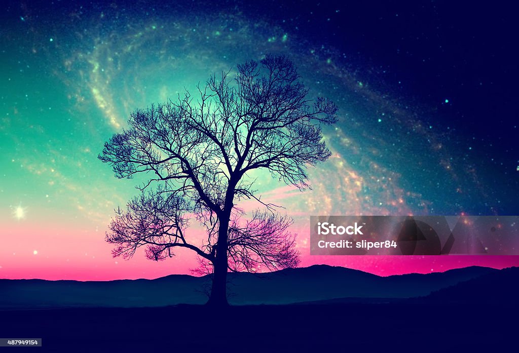 space tree background red alien landscape with alone tree over the night sky with many stars - elements of this image are furnished by NASA 2015 Stock Photo