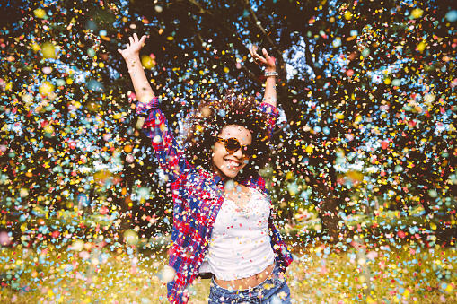 Hipster enjoying confetti