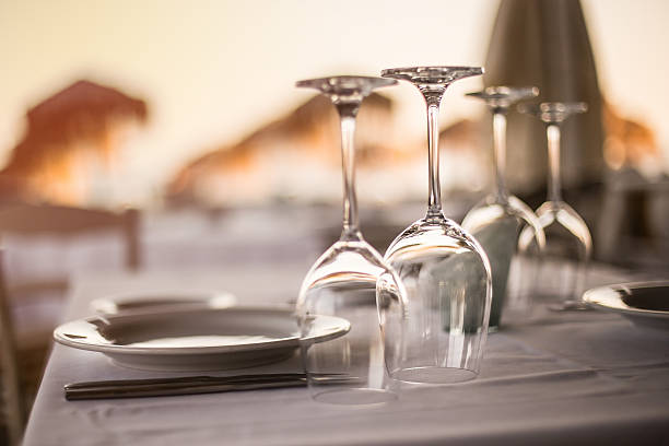 istock Dinner in sunset in restaurant table on the Beach 487961995
