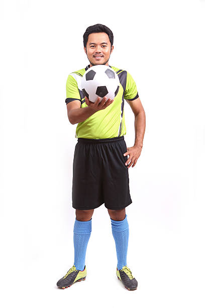 istock Young soccer football player on white 487962017