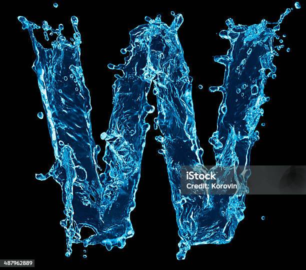 One Letter Of Water Alphabet On Black Background Stock Photo - Download Image Now - Alphabet, Arts Culture and Entertainment, Beauty In Nature