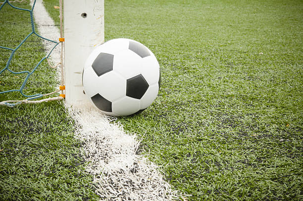 istock Soccer ball on the field 487963379