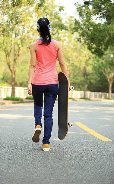 istock skateboarding woman 487964513