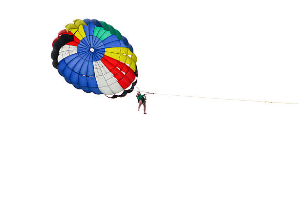 istock Tandem parascending over the sea 487964555