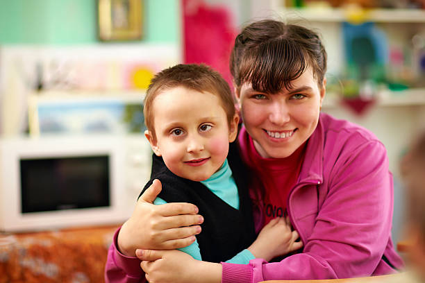 istock cheerful kids with disabilities in rehabilitation center 487966075