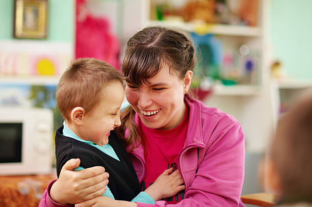 istock cheerful kids with disabilities in rehabilitation center 487966083