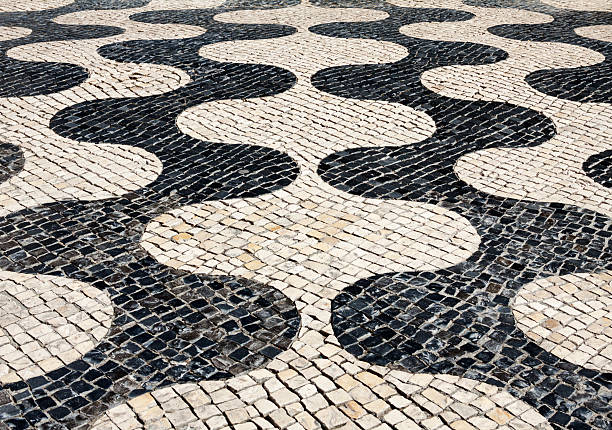 istock Traditional pattern on cobblestone pedestrian street in Cascais, 487966221