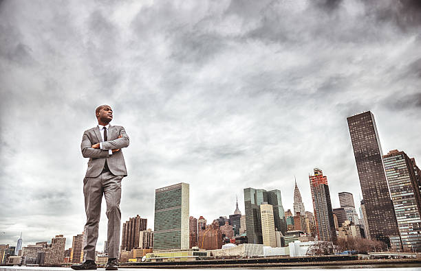 istock Successful business man looking away against the skyline 487966395