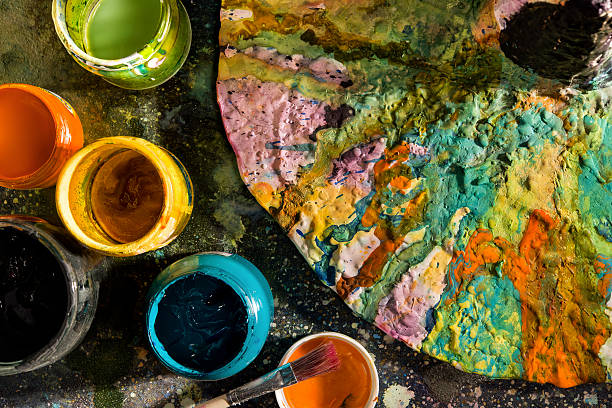 istock Open cans of paint with a palette 487967554