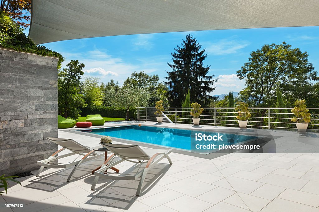 house with pool beautiful house, swimming pool view from the veranda, summer day Swimming Pool Stock Photo