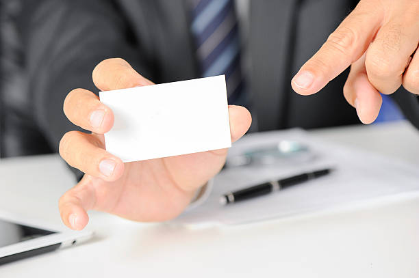 istock Businessman shows business card 487968354