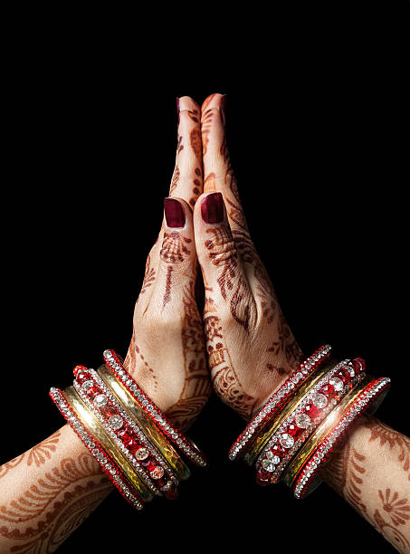 Namaste mudra Woman hands with henna in Namaste mudra on black background mudra stock pictures, royalty-free photos & images