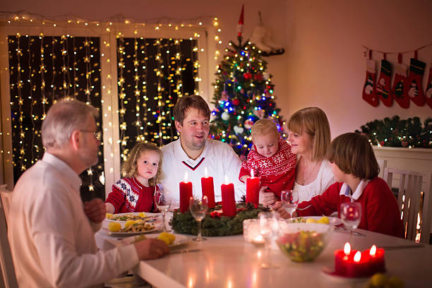istock Family enjoying Christmas dinner at home 487972242