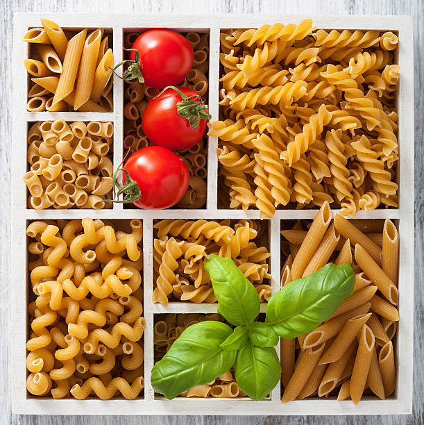 istock various raw wholegrain pasta in white wooden box 487972706