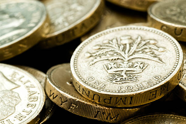istock Macro Close Up of Assorted British Pound Coins 487974614