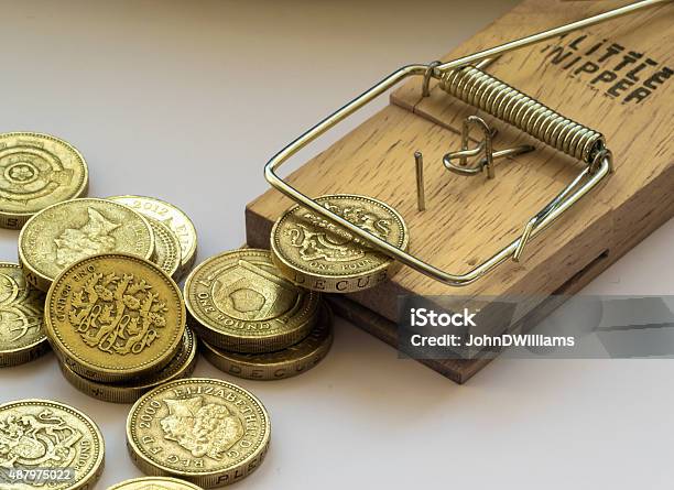 Mouse Trap Catches A British Pound Coin Stock Photo - Download Image Now - 2015, Backgrounds, Bank - Financial Building