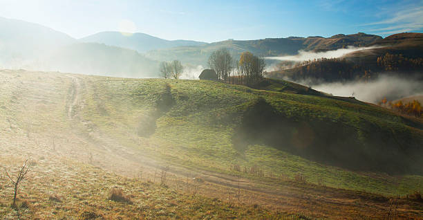 istock Curving road in the autumn landscape 487975918