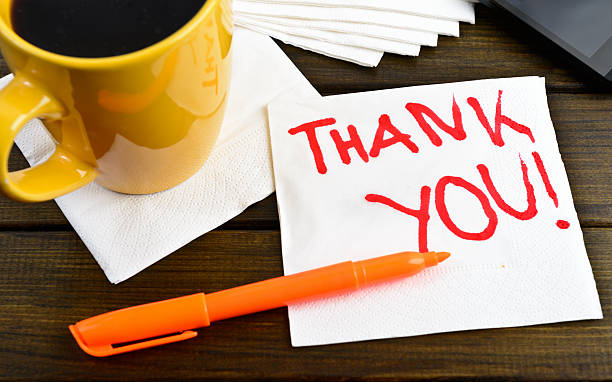 istock Thank you - motivational handwriting on a napkin 487976924
