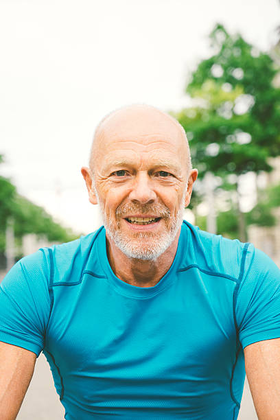 istock Senior Cyclist In A City Street 487977988