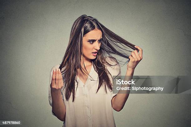 Unhappy Woman Surprised She Is Losing Hair Stock Photo - Download Image Now - Women, Loss, 2015