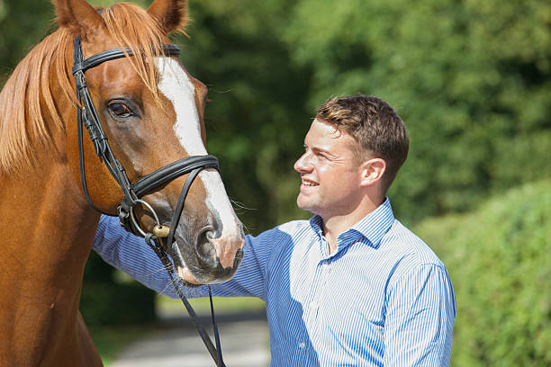 istock Horse owner enjoying exercising his stallion 487979530