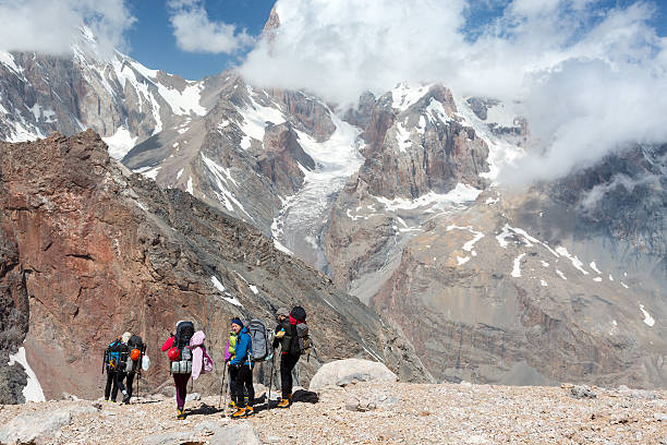 istock Backpackers Team Walking on Rocky Trail 487981158