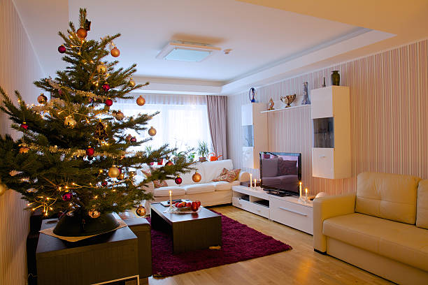 Christmas tree in beautiful modern apartment stock photo
