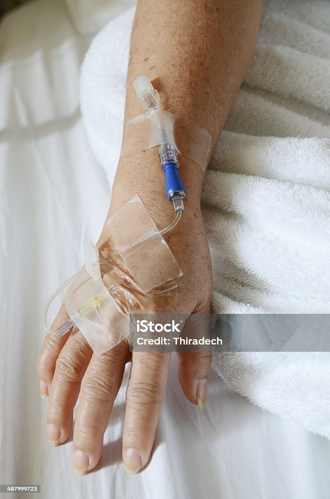Patient's hand saline syringe Accidents and Disasters Stock Photo
