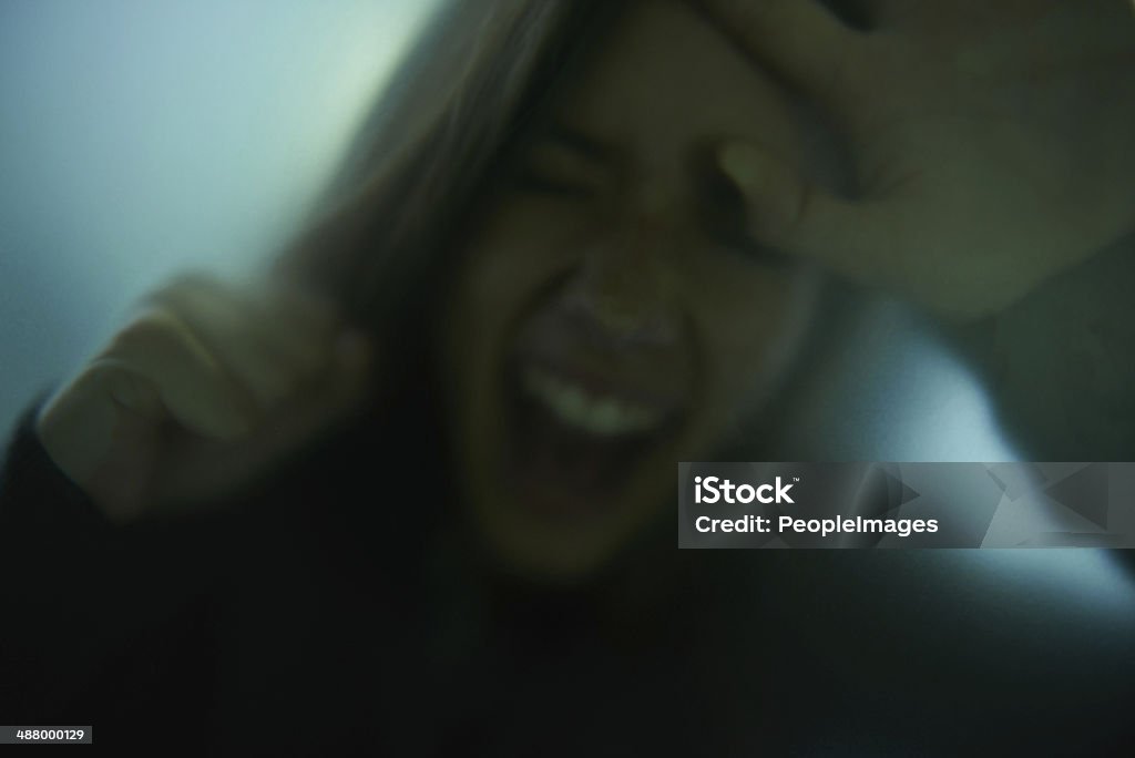 Let me out, please!! A woman frantically trying to escape Adult Stock Photo