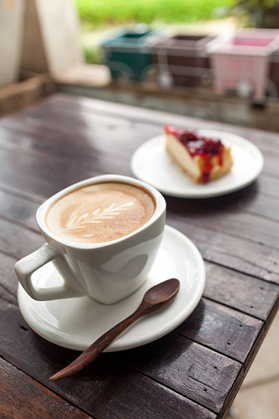 istock Cup of latte coffee with cake 488000697