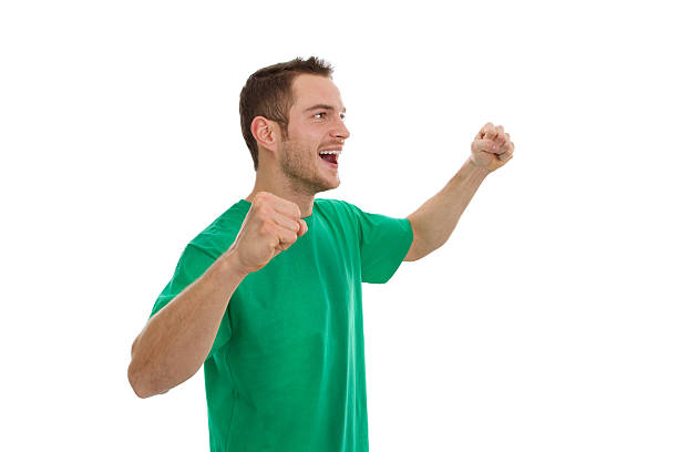 istock Enthusiastic young man in green isolated on white. 488000905