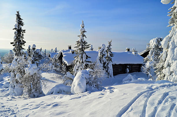 istock Cottages on snowy mountain on a sunny winter day 488001189