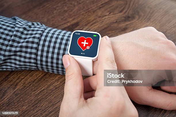 Male Hands White Smartwatch With Mobile App Health Sensor Stock Photo - Download Image Now