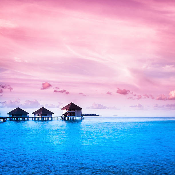 Over water bungalows with steps into amazing green lagoon