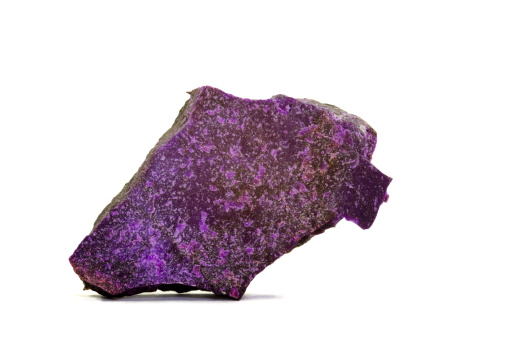 Museum piece isolated on white. Rare Sugilite (also called Lavulite) from the Wessels mine, Northern Cape Province, South Africa.