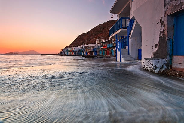 Boat houses on the Milos island, Cyclades, Greece.