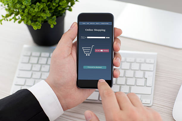istock businessman holding phone with app online on the screen 488003018
