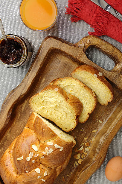 istock Sweet brioche bread on tray with juice and marmalade 488003585