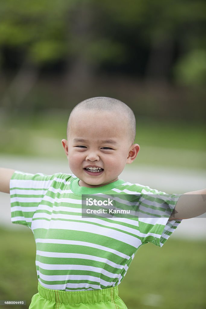 Happy boy outdoors Asian and Indian Ethnicities Stock Photo