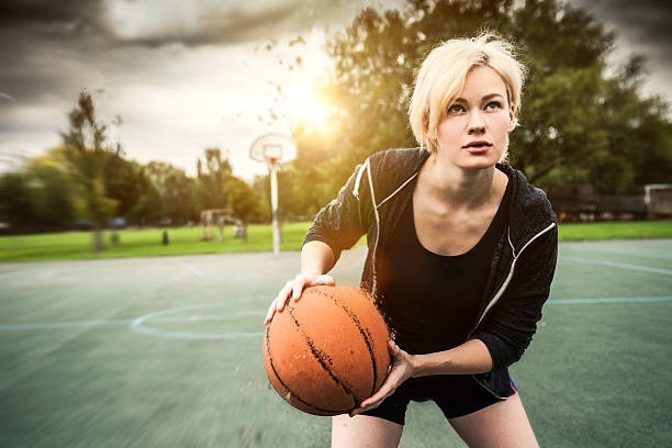 istock Young basketball player training at playground in London 488004962