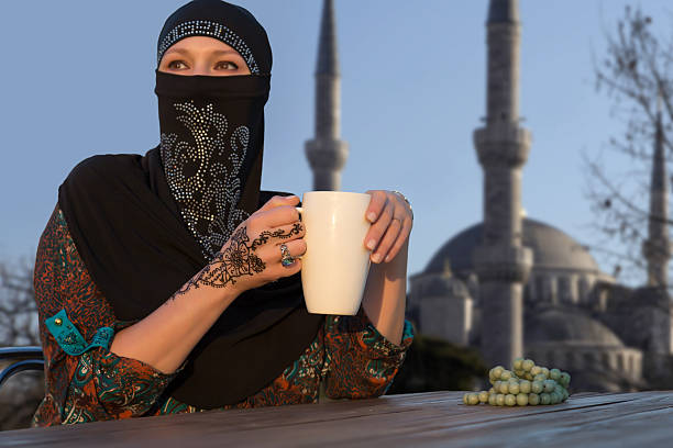 istock Middle Eastern Woman at Cafe Terrace 488005494