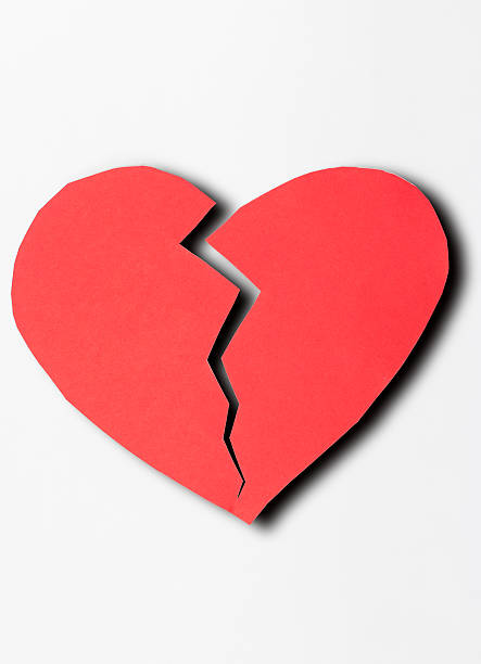 istock close up of paper broken heart on white background 488007692